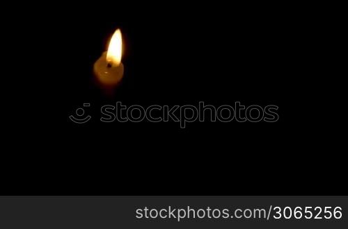 Timelapse burning white candle