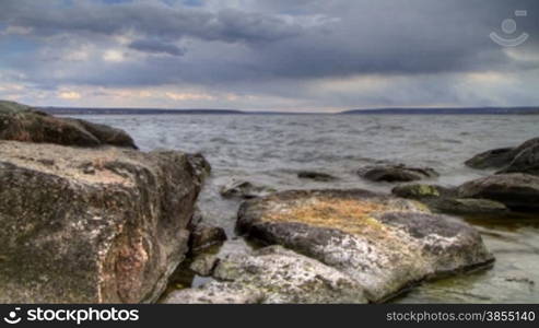 timelapse landscape of granite bank of the river.