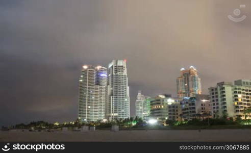 timelapse of miami beach at night city buildings