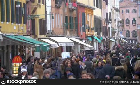 Timelapse of pedestrian street in Venice, Italy crowded with locals and tourists.