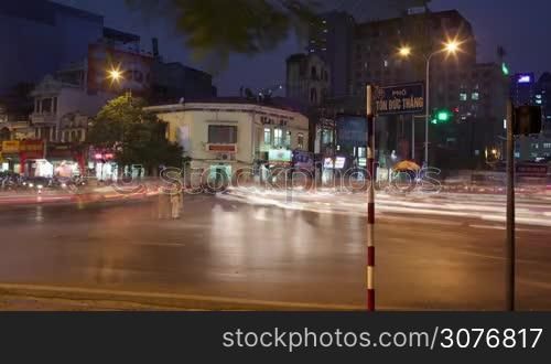 Timelapse shot of busy transport traffic on the junction of Hanoi at night, Vietnam