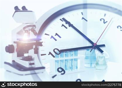times clock with science medical research and pharmaceutical lab concept