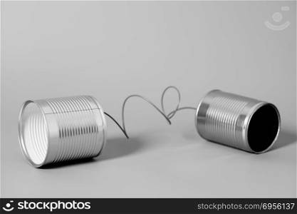 Tin can phone. Communication concept .. Tin can phone on gray. Communication concept .
