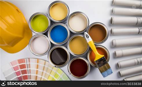 Tin cans with paint and brushes. Paint can and paintbrush