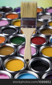 Tin metal cans with color paint and paintbrush