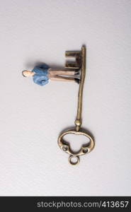 Tiny figurine of man miniature and retro key