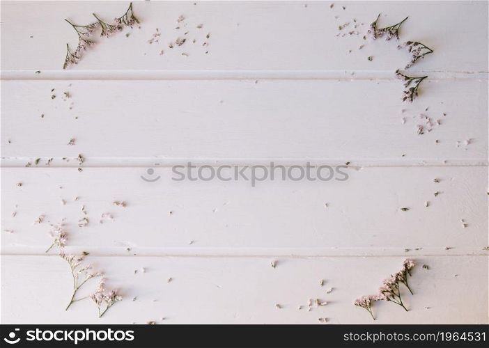 tiny flowers forming circle wooden table. High resolution photo. tiny flowers forming circle wooden table. High quality photo