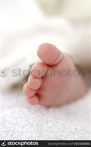 Tiny newborn baby foot close up