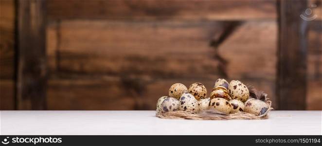 tiny quail eggs on a rustic wood table. tiny quail eggs
