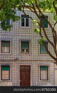 tipical tiles of Lisbon. View of the tipical tiles facade in a building in Lisbon.