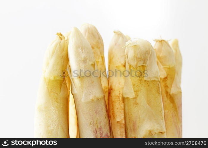 tips of white asparagus. some tips of white asparagus on white background