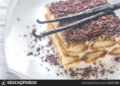 Tiramisu with chocolate topping on the white plate