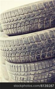 tire, maintenance, service and motor transport concept - close up of wheel tyres