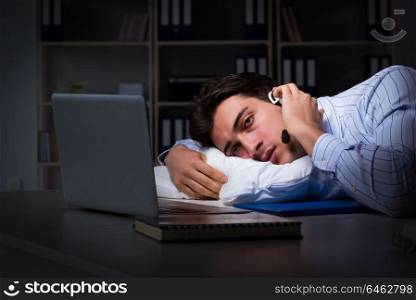 Tired and exhausted helpdesk operator during night shift