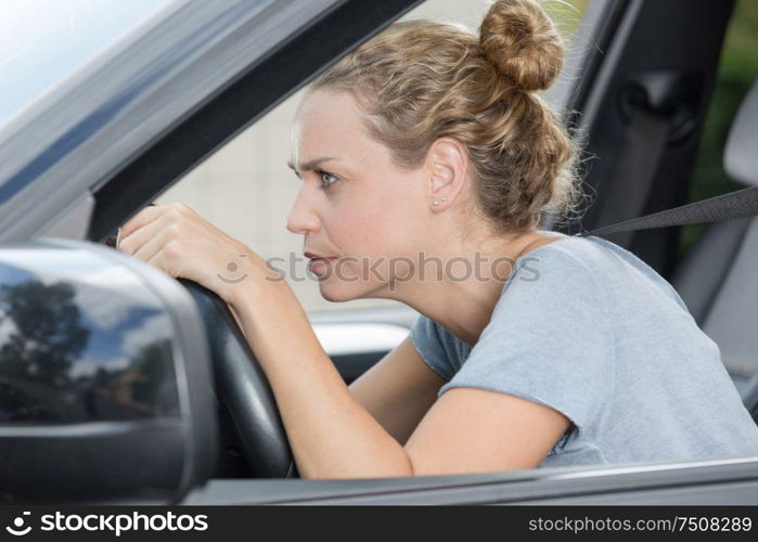 tired beautiful woman in her car
