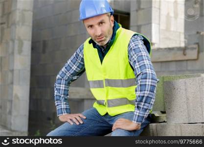 tired builder taking a rest
