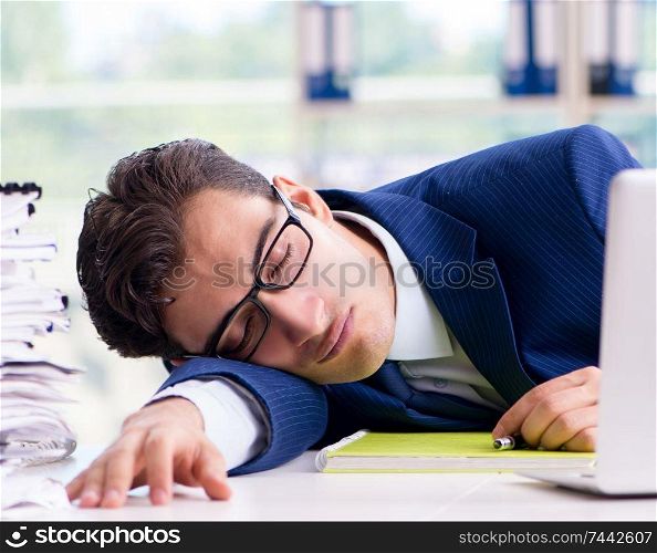 Tired businessman exhausted after hard work and excessive workload. Tired businessman exhausted after hard work and excessive worklo