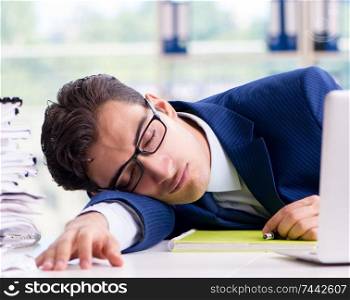Tired businessman exhausted after hard work and excessive workload. Tired businessman exhausted after hard work and excessive worklo