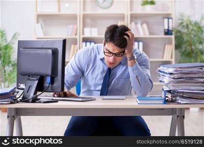 Tired businessman with too much paperwork