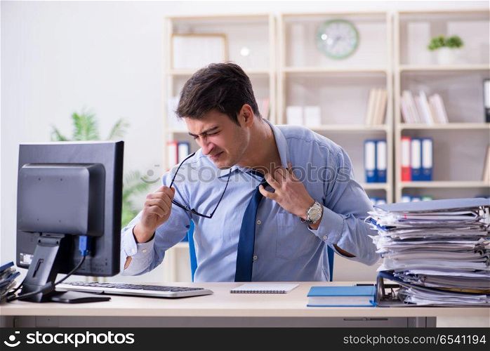 Tired businessman with too much paperwork