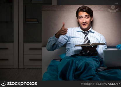 Tired businessman working overtime at home at night