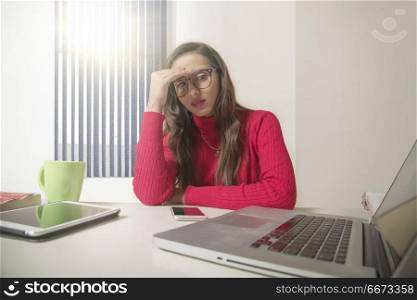 Tired businesswoman suffering from headache