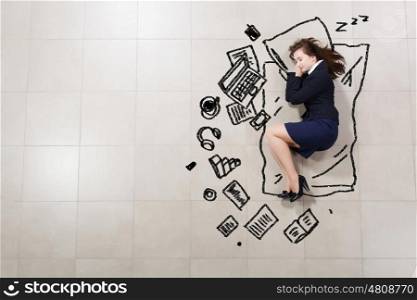 Tired businesswoman. Top view of young tired sleeping businesswoman