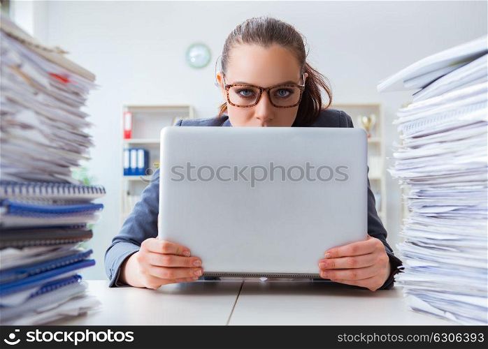 Tired businesswoman with paperwork workload