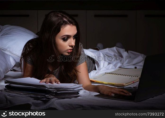 Tired businesswoman working overtime at home at night