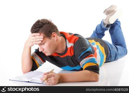 tired college student with book after hard work for exam on white background