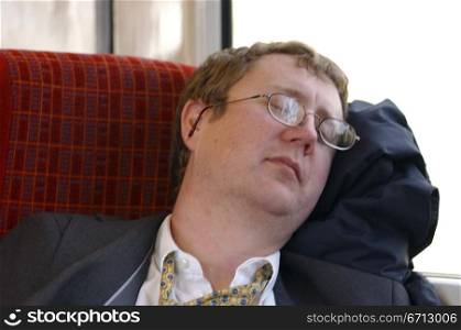tired commuter on train