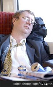 tired commuter on train asleep
