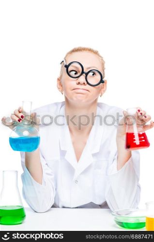 tired crazy chemist in glasses with test tubes conducting experiments in the laboratory