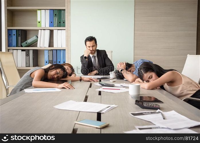 tired exhausted young business man and woman sleeping in meeting room at office