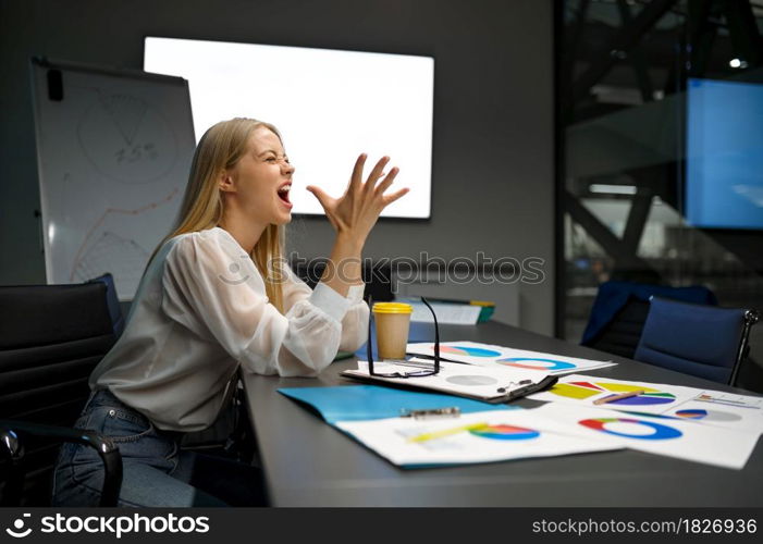 Tired female manager sleeping at the table, IT office. Professional worker, planning or brainstorming. Successful businesswoman works in modern company. Tired female manager sleeping at table, IT office