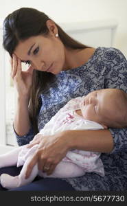 Tired Mother Suffering From Post Natal Depression