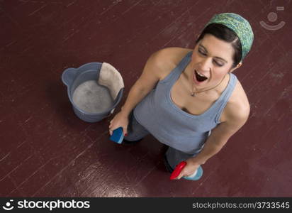 Tired of Work Housekeeper Yawns Working on her Knees