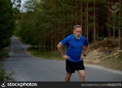 Tired retired sportsman breathing hard after jogging exercise. Sport training outdoors and everyday running activity for healthcare on retirement motivation. Tired retired sportsman breathing hard after jogging exercise