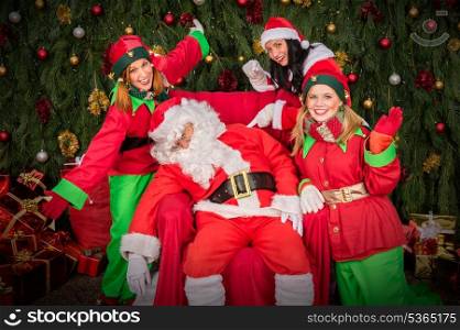 Tired Santa Clause with elf helper sleep chair Christmas decoration