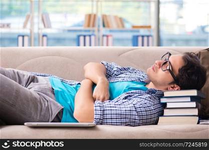 Tired student lying on the sofa 