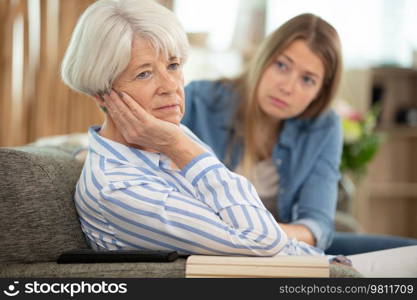 tired upset mature old businesswoman and her daughter