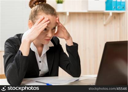 tired woman financial analyst looking for a mistake in the reports