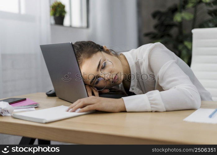 tired woman resting her head laptop