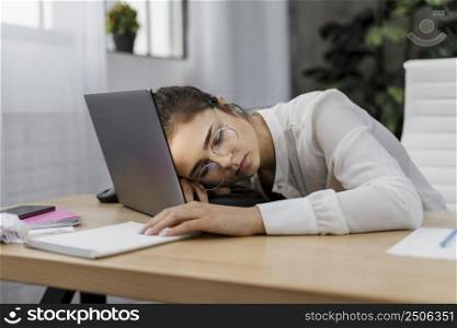 tired woman resting her head laptop