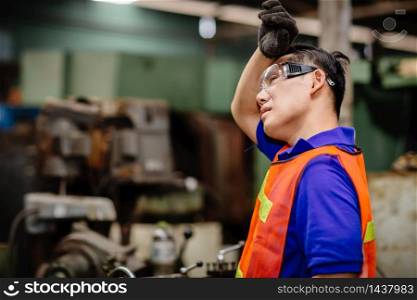 Tired worker, headache hot weather over heat unhealthy engineer working in heavy industry factory.