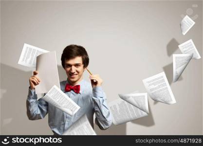 Tired young man. Image of young tired man holding folder with documents