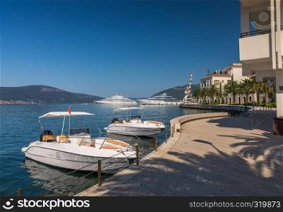 Tivat, Montenegro - 07.11.2018. Embankment of Tivat city, Montenegro, in a sunny summer day. The beginning of the cruise on the Bay of Kotor.. Embankment of Tivat city in Montenegro