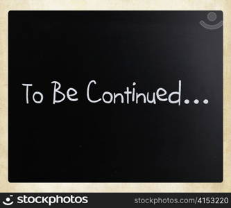 ""To be continued" handwritten with white chalk on a blackboard"