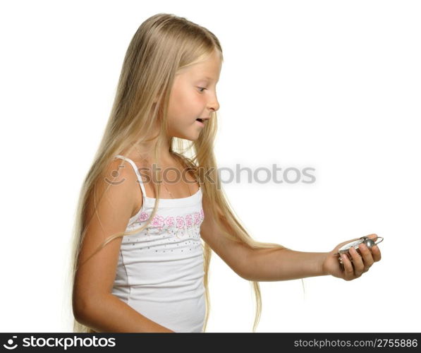 To be late. The girl with amazement looks at an alarm clock. It is isolated on a white background