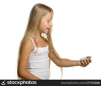 To be late. The girl with amazement looks at an alarm clock. It is isolated on a white background